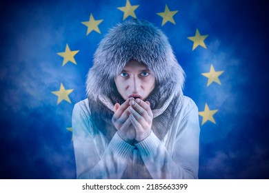 Increase in the price of natural gas for home heating. Transition to renewable energy sources. Energy crisis in Europe. A citizen of Europe freezes in front of the flag. - Shutterstock ID 2185663399