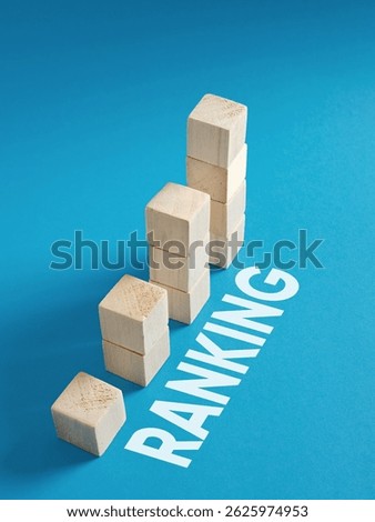 Increase ranking. Search engine optimization SEO rankings concept. Ascending wooden cubes on blue background, symbolizing ranking growth and success in business.