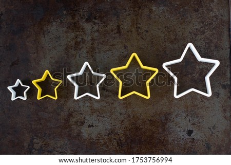 Increase rating, evaluation and classification concept. Increasing five stars on dark background. The best cookery