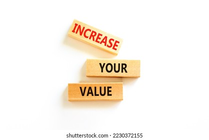 Increase your value symbol. Concept words Increase your value on wooden blocks on a beautiful white table white background. Business increase your value concept. Copy space.
