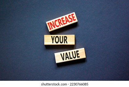 Increase your value symbol. Concept words Increase your value on wooden blocks on a beautiful black table black background. Business increase your value concept. Copy space.