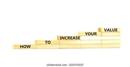 Increase your value symbol. Concept words How to increase your value on wooden blocks. Beautiful white table white background. Business how to increase your value concept. Copy space.