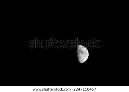 Similar – Image, Stock Photo Increasing crescent moon in dark blue evening sky with light clouds, moon craters and moon seas are visible