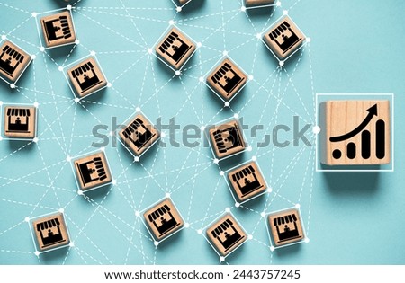 Increasing graph chart connection linkage with franchise shop and supermarket , Business sale growth and expand shop franchise concept.