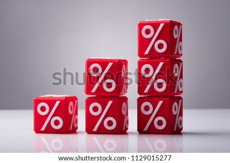 Increasing Stacked Red Cubes With Percentage Symbol Showing Upward Direction