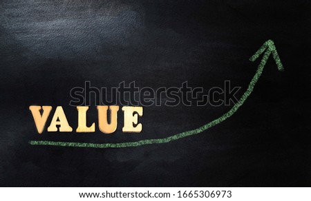 Increasing Value Arrow Graph Concept. drawing growing value graph with wooden letters