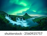 Incredible icelandic landscape with incredible sky with Northern lights over Kirkjufellsfoss waterfall. Kirkjufell volkano mountain and Polar lights in Iceland. Aurora borealis