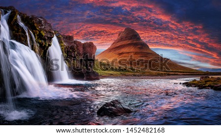 Incredible Nature landscape of Iceland. Fantastic picturesque sunset over Majestic Kirkjufell (Church mountain) and waterfalls. Kirkjufell mountain, Iceland. Famous travel locations. 