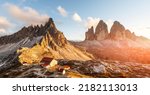 Incredible sunset at the Tre Cime di Lavaredo and rifugio Locatelli in Dolomite Alps. Three peaks of Lavaredo, Dolomites, South Tyrol, Italy, Europe. Landscape photography panorama