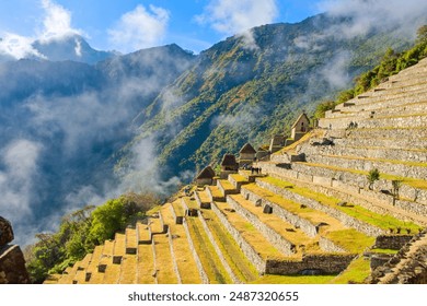 The incredible terraces of Machu Picchu in the morning mist in Peru (Machu Picchu)