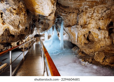 Incredible underground world of the Demanovska ice cave with ice pillars. Location place Low Tatras National Park, Slovakia, Europe. Photo wallpaper. Famous landmarks. Discover the beauty of earth.
