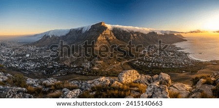 The incredible view from Lion's Head over Table Mountain, Cape Town and Camps Bay at sunset, Cape Town, South Africa.