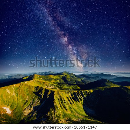 Incredible view of starry sky over summits. Location place of Carpathian mountains, Ukraine, Europe. Long exposure shot, astrophotography. Picturesque nature photography. Discover the beauty of earth.