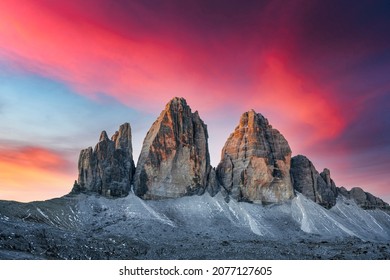 Incredible view of the Three Peaks of Lavaredo on sunset time. National Park Tre Cime di Lavaredo, Dolomite Alps mountains, Trentino Alto Adige region, Sudtirol, Dolomites, Italy - Shutterstock ID 2077127605