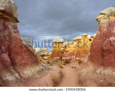the incredibly colorful, eroded, pink and yellow hoodoo rock formations of paint mines interpretive park in winter near calhan, colorado