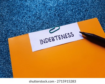Indebteness writting on table background. 
