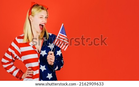 Independence Day celebration. July 4th. Winking girl with American flag. National colors USA.