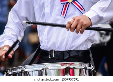 Independence Day celebration parade in Costa Rica. Student plays drums in a band in street parade.  - Powered by Shutterstock