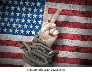 Independence: Hand Victory Sign In Chains And The Flag Of United States Of America, USA