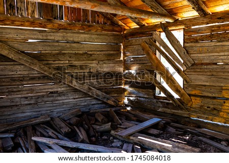Independence Pass mining townsite wooden cabin interior with sunlight through window in White River National Forest in Colorado