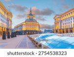 Independence Square in Sofia Bulgaria, featuring the Socialist Classicism architecture of the Party House and government buildings illuminated at sunset.