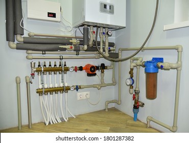 Independent Heating System In Boiler Room At Home. Domestic Water Supply System. Water Supply For Underfloor Heating. Rainwater Filter System. Servo, Sensors And Temperature Control. Soft Focus