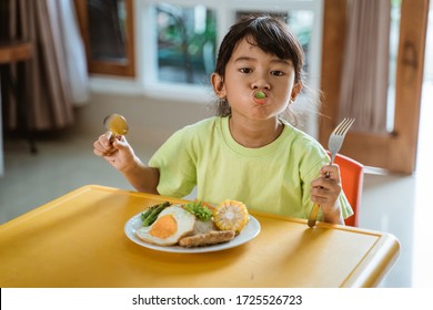 Independent Kid Self Eating At Home Having Some Breakfast