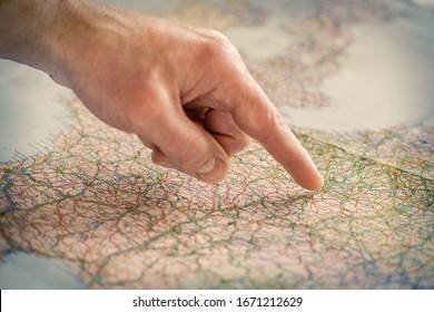 The Index Finger Points To Some Place On The Map. Travel Concept.