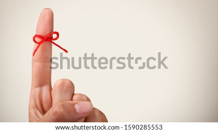 Index finger tied with rope, Reminder concept