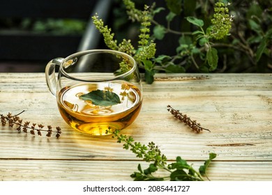 India, 26 November, 2021 : Tulsi Tea Served In A Glass Cup With Leaf, Holy Basil Tea.