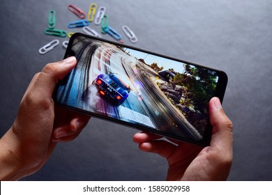 INDIA, DELHI - February 12, 2019: Playing Game On Android Mobile Phone On Dark Background