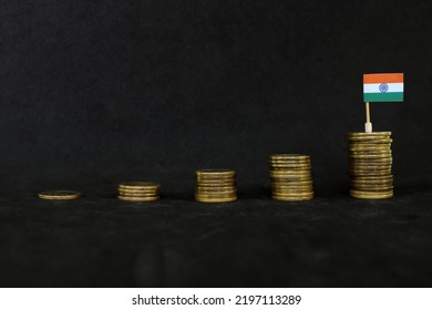 India Economic Growth, Recovery After Financial Crisis And Peso Appreciation Concept. Indian Flag In Increasing Stack Of Coins In Dark Black Background.