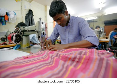 INDIA - FEB 26: Textile Workers In A Small Factory In Old Delh On February 26, 2008 In Delhi, India. Many Small Factories Provide The West With Their Clothes.