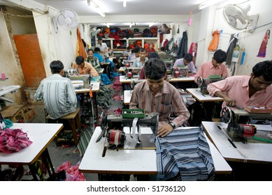 INDIA - FEB 26: Textile Workers In A Small Factory In Old Delh On February 26, 2008 In Delhi, India. Many Small Factories Provide The West With Their Clothes.