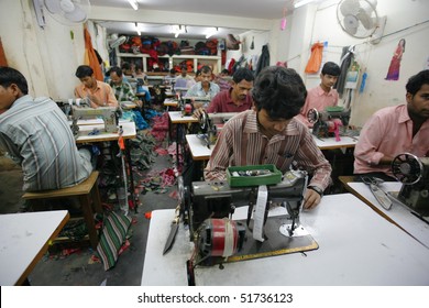 INDIA - FEB 26: Textile Workers In A Small Factory In Old Delh On February 26, 2008 In Delhi, India. Many Small Factories Provide The West With Their Clothes.