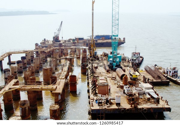 India, Goa - 31 March 2018:\
Construction of a concrete bridge for cars across the big\
river