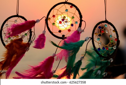 INDIA, GOA, ARAMBOL BEACH 2017
Dream catchers with pink and green feathers blown around by a light sea breeze
on arambol beacn at sunset time 