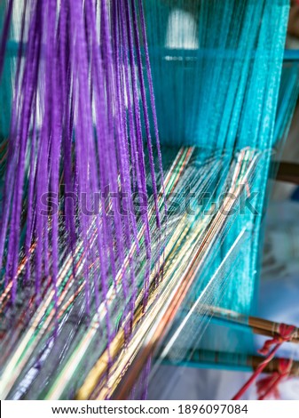 India Handloom Board. Loom of weaving Colored threads.