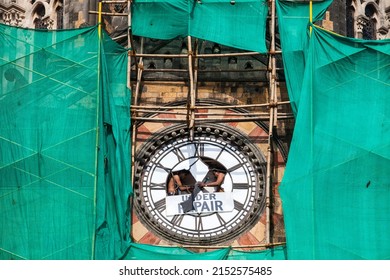 India, Maharashtra, Mumbai, August 31, 2009: Clock repairers working to restore the functioning of the clock at Chhatrapati Shivaji Maharaj Terminus, formerly Victoria Terminus. 