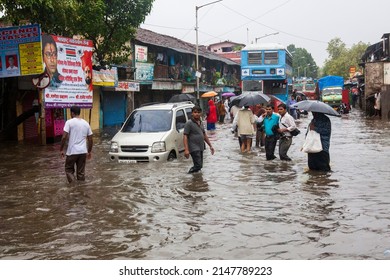 India, Maharashtra, Mumbai, July 14, 2009: People Walk Through A Flooded Street Due To Heavy Rains At Kurla.