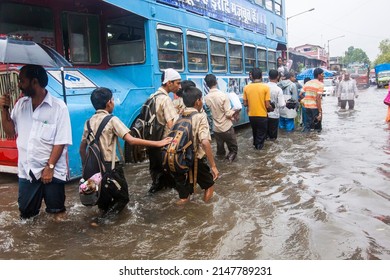 India, Maharashtra, Mumbai, July 14, 2009: People Walk Through A Flooded Street Due To Heavy Rains At Kurla.