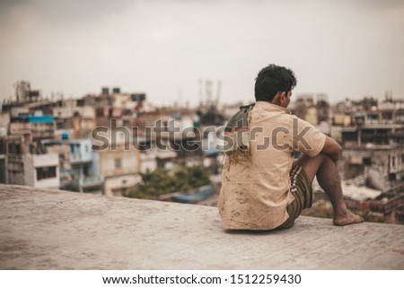 India Man Sitting On Old Delhi Rooftop