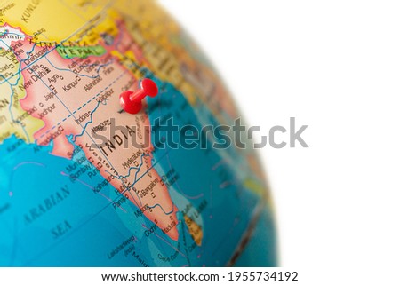 India map. Earth globe close up with a red pin in India.