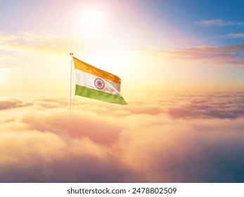 India national flag aerial view clouds in beautiful sky. Top view. Drone. Aerial bird's eye fly flag. Aerial top flag view cloudscape. Flag with Sunrise or sunset over clouds. - Powered by Shutterstock