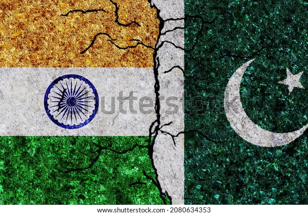 India and Pakistan painted flags on a wall with\
grunge texture. India and Pakistan conflict. Pakistan and India\
flags together. India vs\
Pakistan