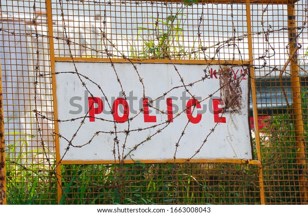 India\
Police Traffic Barricades on the side of the\
Road