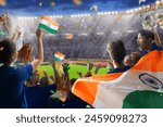 India sport supporter on stadium. Indian fans on cricket, rugby or football pitch watching team play. Group of supporters with flag and national jersey cheering for India. Championship game.