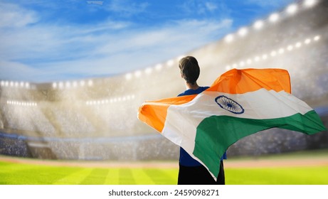 India sport supporter on stadium. Indian fans on cricket, rugby or football pitch watching team play. Group of supporters with flag and national jersey cheering for India. Championship game. - Powered by Shutterstock