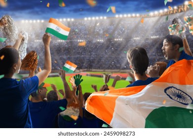 India sport supporter on stadium. Indian fans on cricket, rugby or football pitch watching team play. Group of supporters with flag and national jersey cheering for India. Championship game. - Powered by Shutterstock