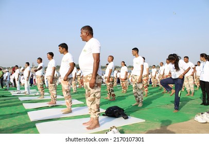 India Tibetan Border Police do Yoga on 21st, June 2022 on the occasion of 8th International Yoga Day near the river bank of Ganga, Yamuna and Saraswati in Prayagraj city of India.